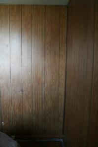 The before shot - hideous wood paneling